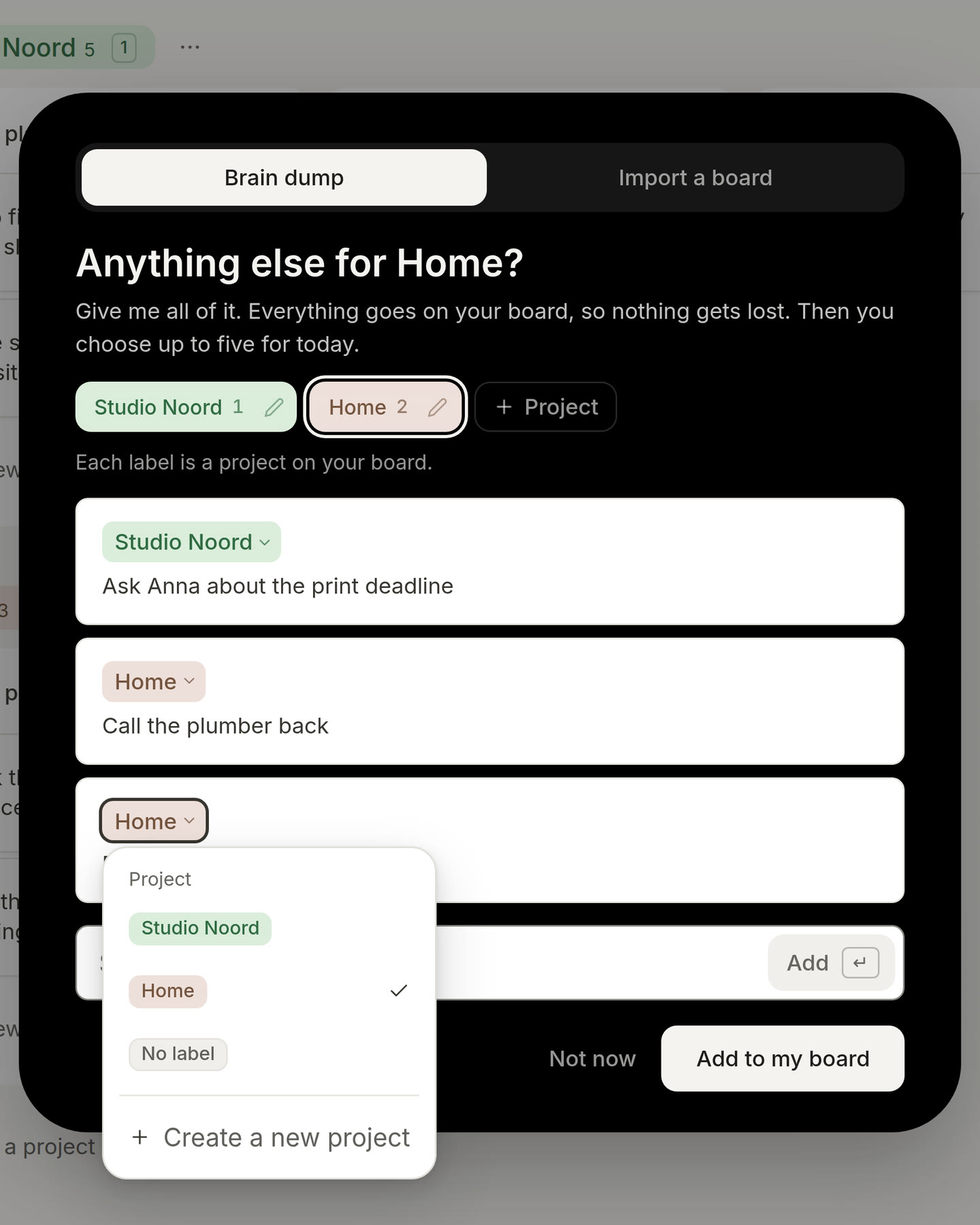 The brain dump with three things typed. The project pill on the last card is pressed: a list opens with every project, No label and Create a new project