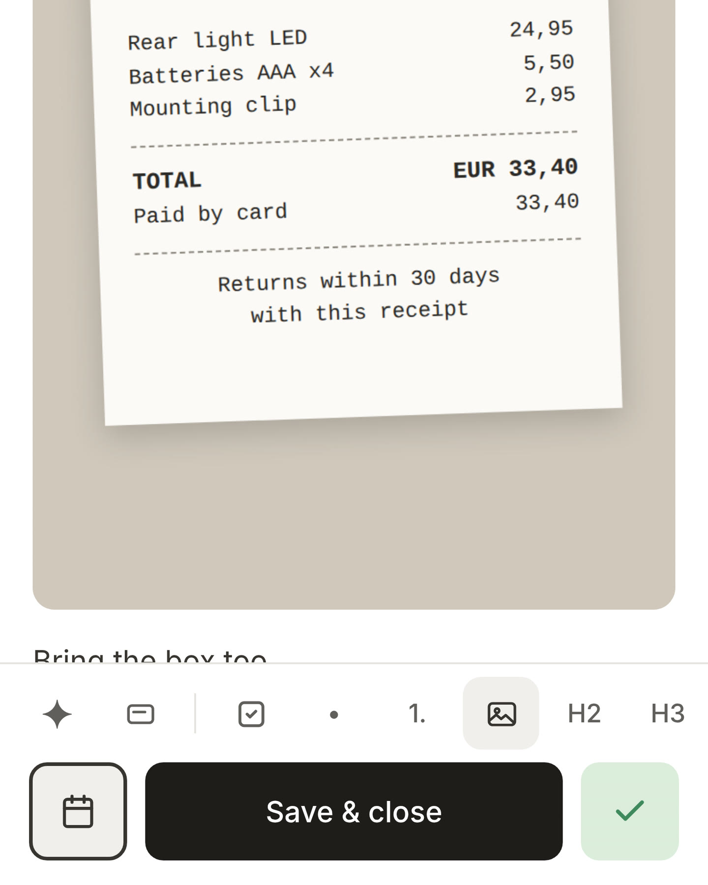An open card on a phone with a photo in the note, and the picture button pressed in the bar at the bottom